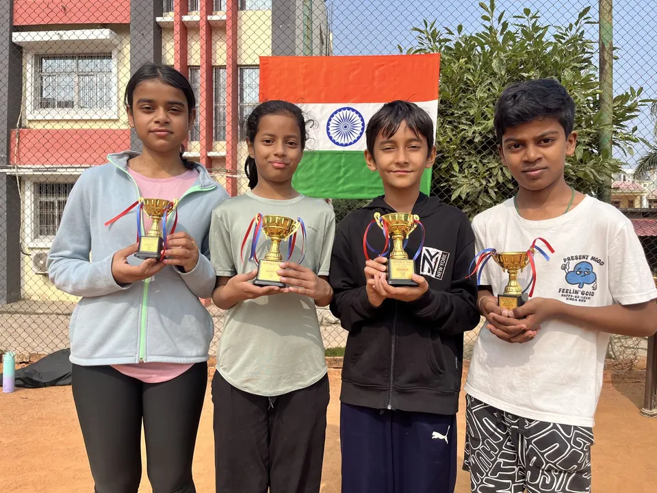 Four young PLAY n FIT players holding trophies