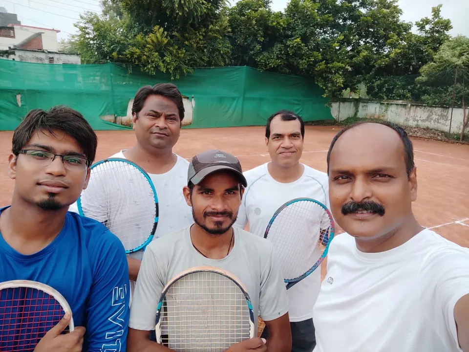 Group of adult players with racquets after a session
